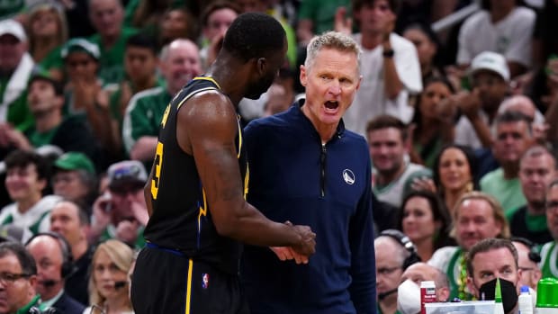 Jun 10, 2022; Boston, Massachusetts, USA; Golden State Warriors forward Draymond Green (23) talks with head coach Steve Kerr during the first quarter of game four in the 2022 NBA Finals against the Boston Celtics at the TD Garden. Mandatory Credit: David Butler II-USA TODAY Sports